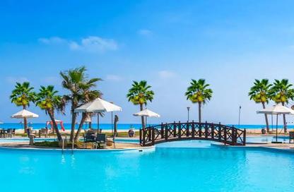 Chalet - 2 Bedrooms - 3 Bathrooms for sale in Bungalows - Markaz Al Hamam - North Coast