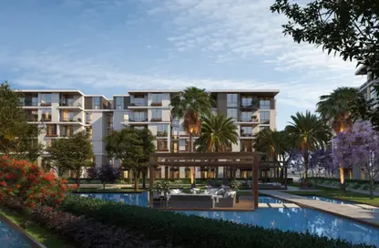 Apartment - 2 Bedrooms - 2 Bathrooms for sale in Tesla Residence - Al Wahat Road - 6 October City - Giza