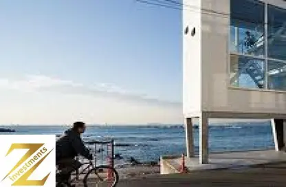 Duplex - 4 Bedrooms - 5 Bathrooms for sale in Beit Al Bahr - Sidi Heneish - North Coast