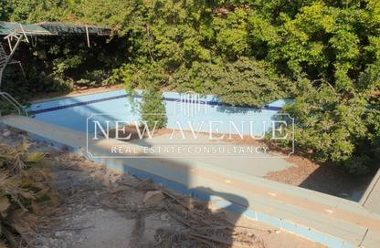 Villa - 5 Bedrooms - 4 Bathrooms for sale in Mena Garden City - Al Motamayez District - 6 October City - Giza