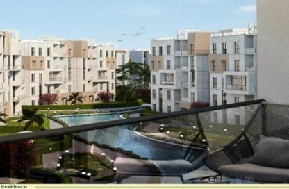Apartment - 3 Bedrooms - 3 Bathrooms for sale in Aqmar - Al Wahat Road - 6 October City - Giza