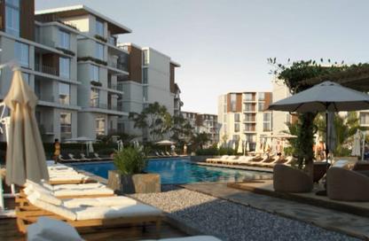 Apartment - 2 Bedrooms - 2 Bathrooms for sale in Tesla Residence - Al Wahat Road - 6 October City - Giza