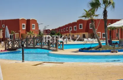 Chalet - 2 Bedrooms - 2 Bathrooms for sale in Bungalows North Coast - Bungalows - Markaz Al Hamam - North Coast