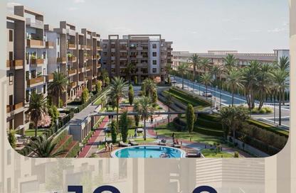 Apartment - 4 Bedrooms - 4 Bathrooms for sale in Aqmar - Al Wahat Road - 6 October City - Giza
