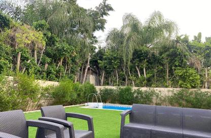 Villa - 6 Bedrooms - 5 Bathrooms for sale in Mena Garden City - Al Motamayez District - 6 October City - Giza