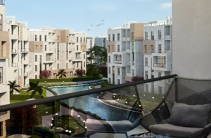 Apartment - 2 Bedrooms - 2 Bathrooms for sale in Aqmar - Al Wahat Road - 6 October City - Giza