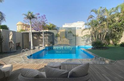 Villa - 4 Bedrooms - 4 Bathrooms for sale in Mena Garden City - Al Motamayez District - 6 October City - Giza